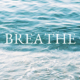 The word Breathe on top of an image of waves