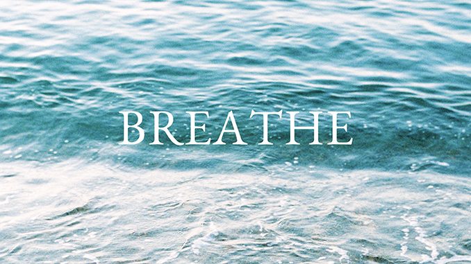 The word Breathe on top of an image of waves