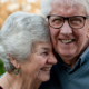 A elderly couple smiling